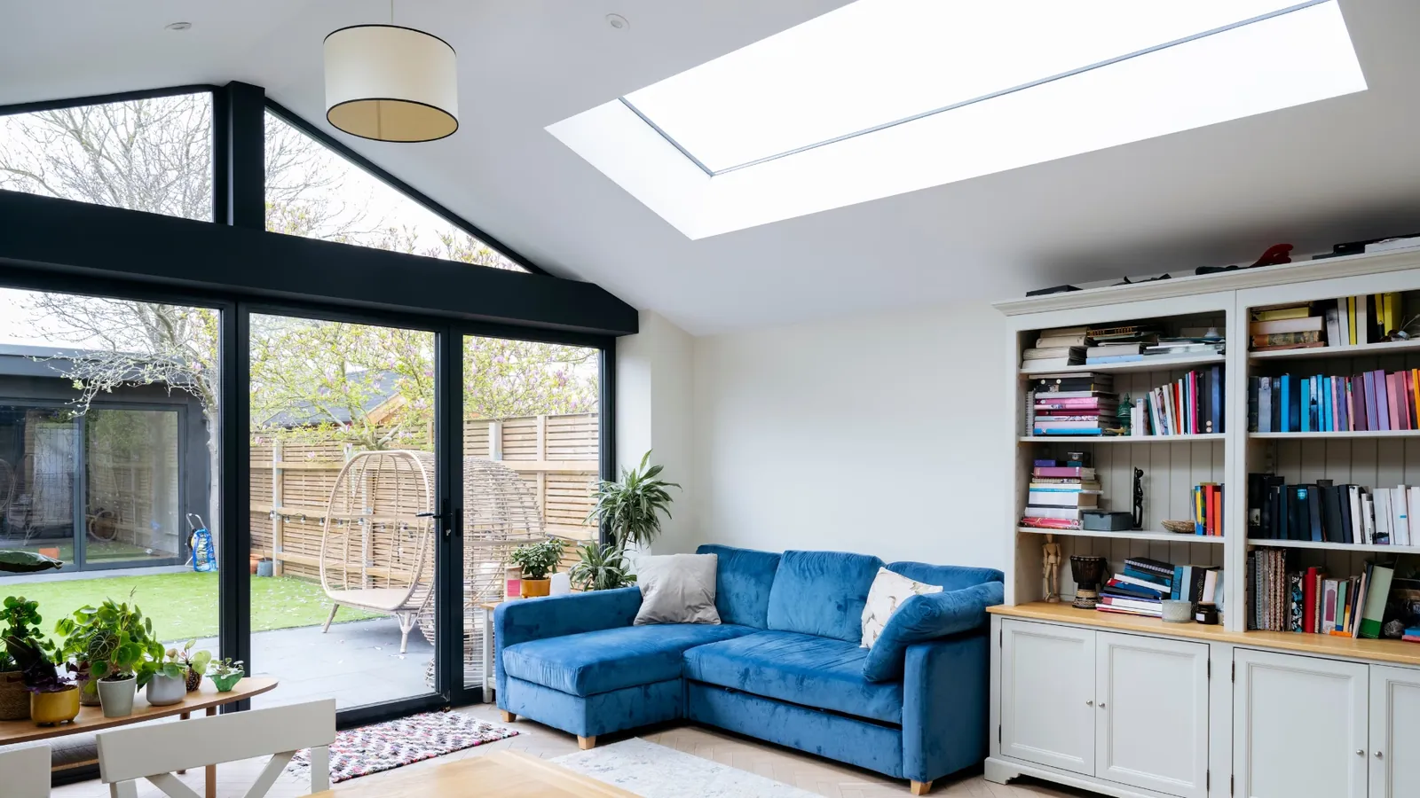 Finished kitchen extension with blue sofa.