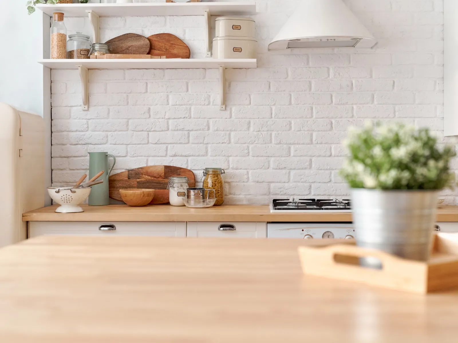Finished kitchen renovation with white brick backsplash.