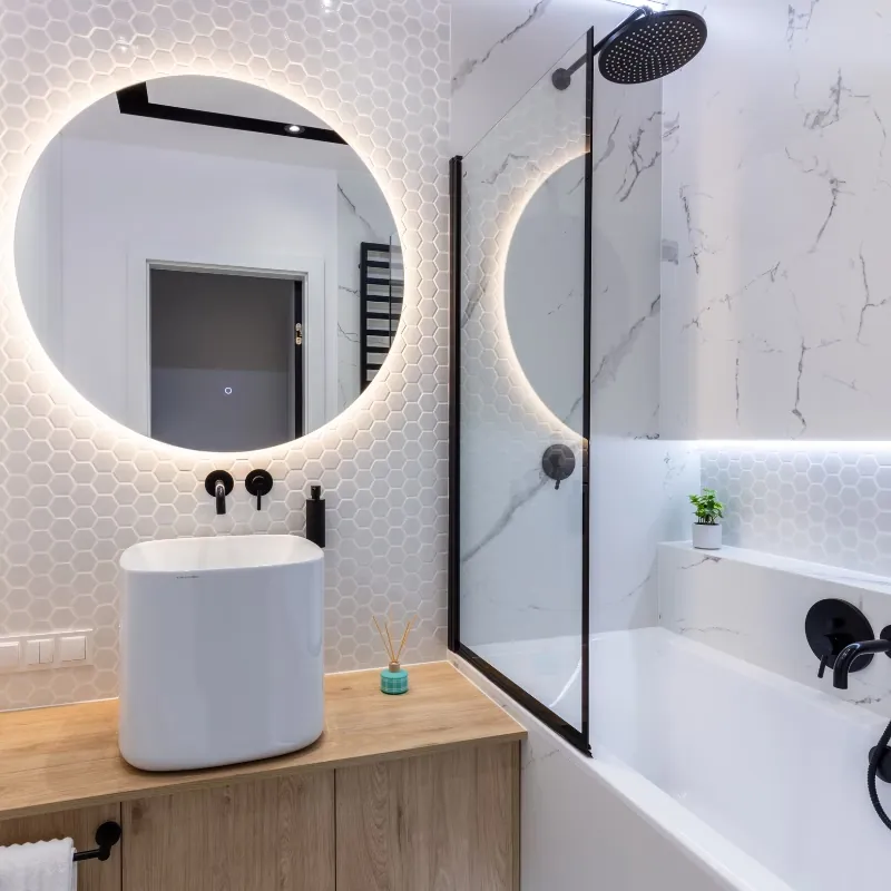 Finished bathroom renovation with walk-in shower.