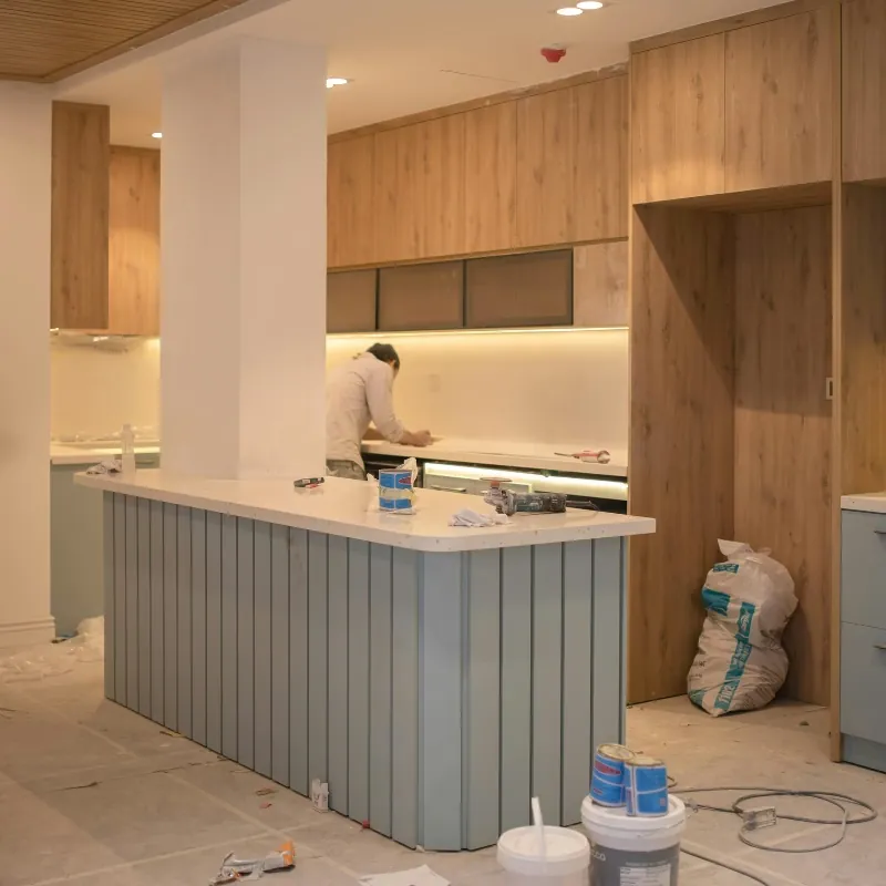Finished kitchen renovation with island and fitted cabinetry.