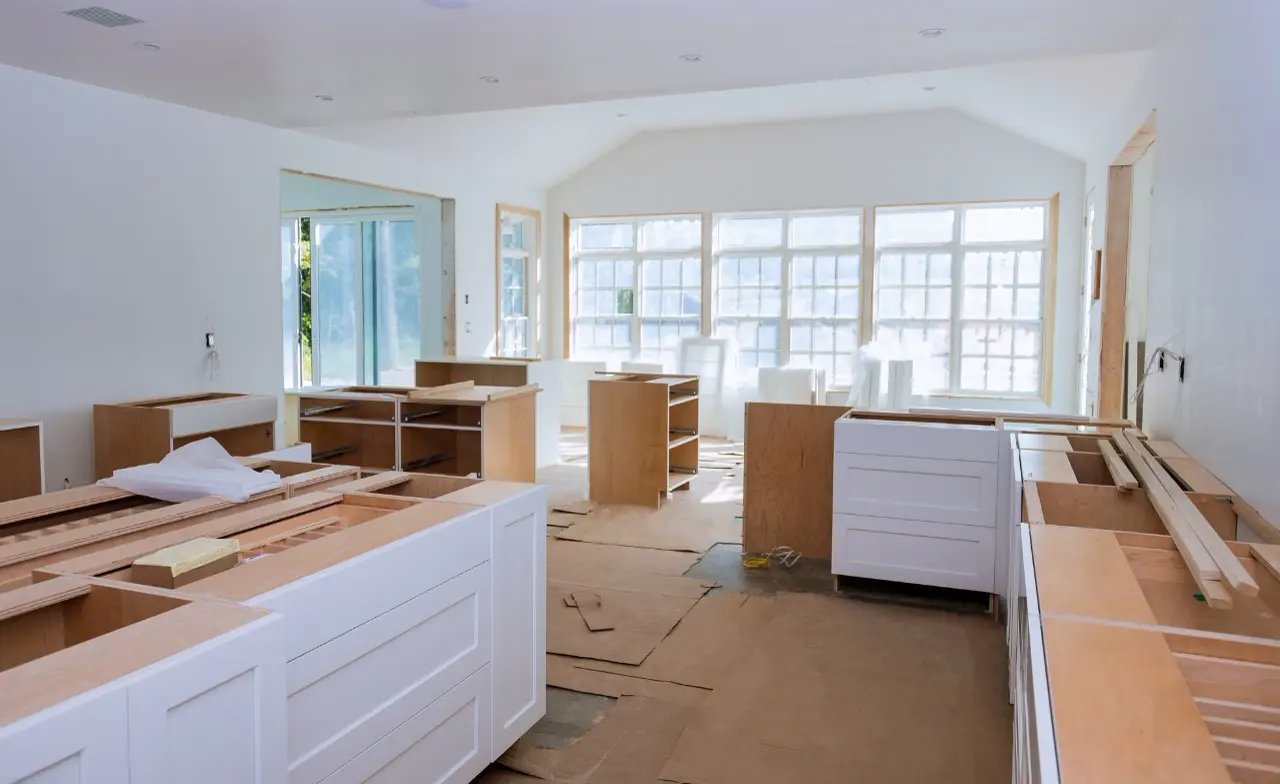 Kitchen extension in progress with new units and garden-facing glazing